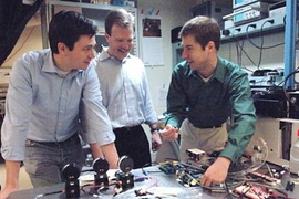 Postdoctoral associate Michel Godin, left, Associate Professor Scott
Manalis of biological engineering and postdoctoral associate Thomas Burg are part of an MIT team that has developed a technique to measure the mass of single cells.