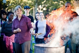 Amy Smith demonstrates a charcoal burn to students.