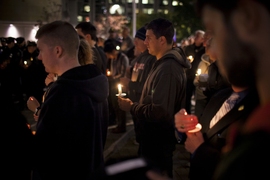 Approximately 200 people gathered at 10:20 p.m. to mark the moment when Officer Sean Collier was slain in the line of duty six months ago, on April 18.