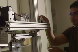 Khalid Jawed, a PhD student in mechanical engineering, experiments with a thin polymeric rod.