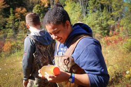 Theresa Oehmke studies the ecosystem of a bog during an ecology class run by Harold Hemond, the William E. Leonhard Professor of Engineering