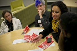 Four students surround round table with Black Lives Matters pamplets.