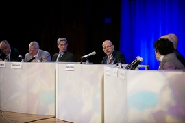 Debate moderator Anthony Cortese (center) directs a question to the pro-divestment team during Thursday's debate on fossil fuel divestment.