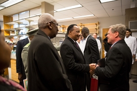 Issoufou (left) greets MIT's director of international affairs Bernd Widdig (right)