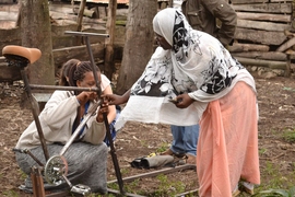 At IDDS in Tanzania last summer two participants, Mwanaharusi Goha from Tanzania and Helen Amorin from Ghana, work on building a bicycle-powered coffee bean sheller to be used by local farmers.  
