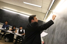 Brent Avery of team "I Love Lemons" solves a problem. Looking on are his teammates (from left) Antonio Monreal, Kalyn Younger, and Josue Sican.