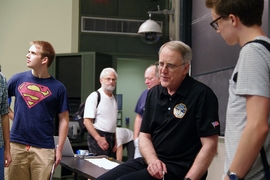 Binzel, who is a member of the science team for the New Horizons mission to the Kuiper Belt, talks with audience members after his talk about the mission.