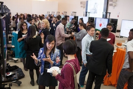 Students in the final stage of MIT IDEAS competition present their projects to judges and visitors at the innovation showcase.