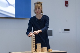 Kimberly Smith, a member of the Learning Beautiful team and a graduate student in the Social Computing Group at the MIT Media Lab, demonstrates devices for hands-on learning materials for young children to learn about computation.
