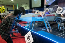 A student competes in the 2017 MIT Mechanical Engineering 2.007 Student Design Final Robot Competition.