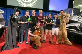 Left to right: Professor Amos Winter (as Darth Vader); Joshua Graves; 3rd place finisher Brandon McKenzie; 1st place winner Tom Frejowski (kneeling); 2nd place finisher Richerd Moyer; 4th place finisher ZhiYi Liang; Gabriel Li; and Professor Sangbae Kim (as Chewbacca).