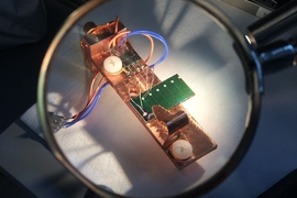 This experimental setup was used by the team to measure the electrical output of a sample of solar cell material, under controlled conditions of varying temperature and illumination. The data from those tests was then used as the basis for computer modeling using statistical methods to predict the overall performance of the material in real-world operating conditions.
