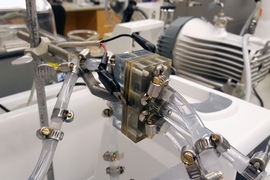 Photo shows the proof-of-concept battery built by the research team to demonstrate how their system could work in practice. The battery lasted through 24 days of use and standby cycles, compared to just three days for a comparable battery without the new protective system in place.