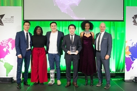 Members of JobGet, a mobile tool that helps low-income job seekers, pose with IIC organizers and sponsors after winning the grand prize in the income and job creation category.