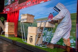 Beekeeping hobbyist Tony Pulsone demonstrates Aris, a lifting apparatus to help beekeepers maneuver heavy crates of bees and honey.