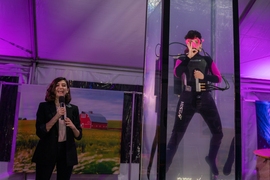 In a water tank set up outside Kresge Auditorium, a scuba diver shows off Rho, a buoyancy control device that can help a diver smoothly float up and down while staying naturally buoyant.