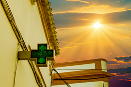 Photo collage shows a green-cross digital sign says 41 degrees Celsius on a building, and the sun is shining in the sky.