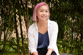 Susan Su portrait with tall bamboo in background. 