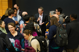 Pat Gelsinger smiles as he is surrounded by people eager to talk to him after the event.