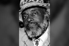 Mel King portrait in monochrome. He wears a woven brimmed hat and bolo tie.