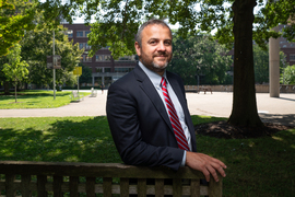 Justin Reich stands outside with MIT Medical in background.