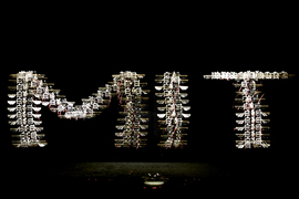 A time-lapse photo of the robotic insect’s flight path spells out “MIT.” 