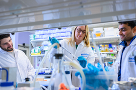 Stefani Spranger in the lab with two other people.