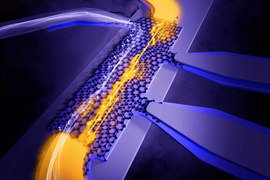 3D rendering shows yellow energy shooting across layers of a graphene lattice laid out on a flat surface. White energy appears from another segment.