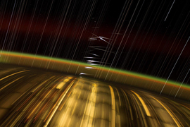 Long exposure of Earth’s city lights, stars, and satellites in low orbit