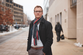 Kevin Dorst outside with scarf on a winter day.