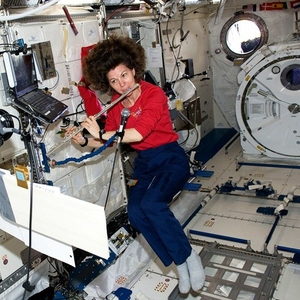 astronaut playing flute in space