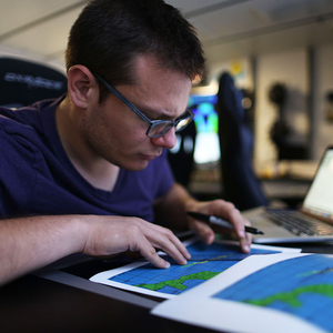 man looking at a map of the ocean